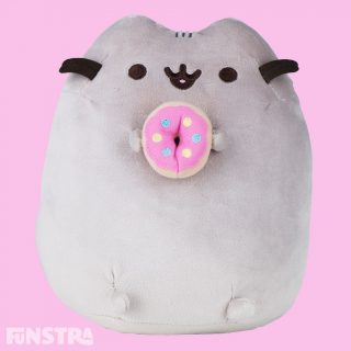 Pusheen satisfies her sweet tooth with a tasty-looking frosted donut. Pusheen is the snack-loving cat who loves to go on adventures with friends like Sloth, Stormy, Pip and Cheek in her popular webcomic with over 10 million social media fans!
